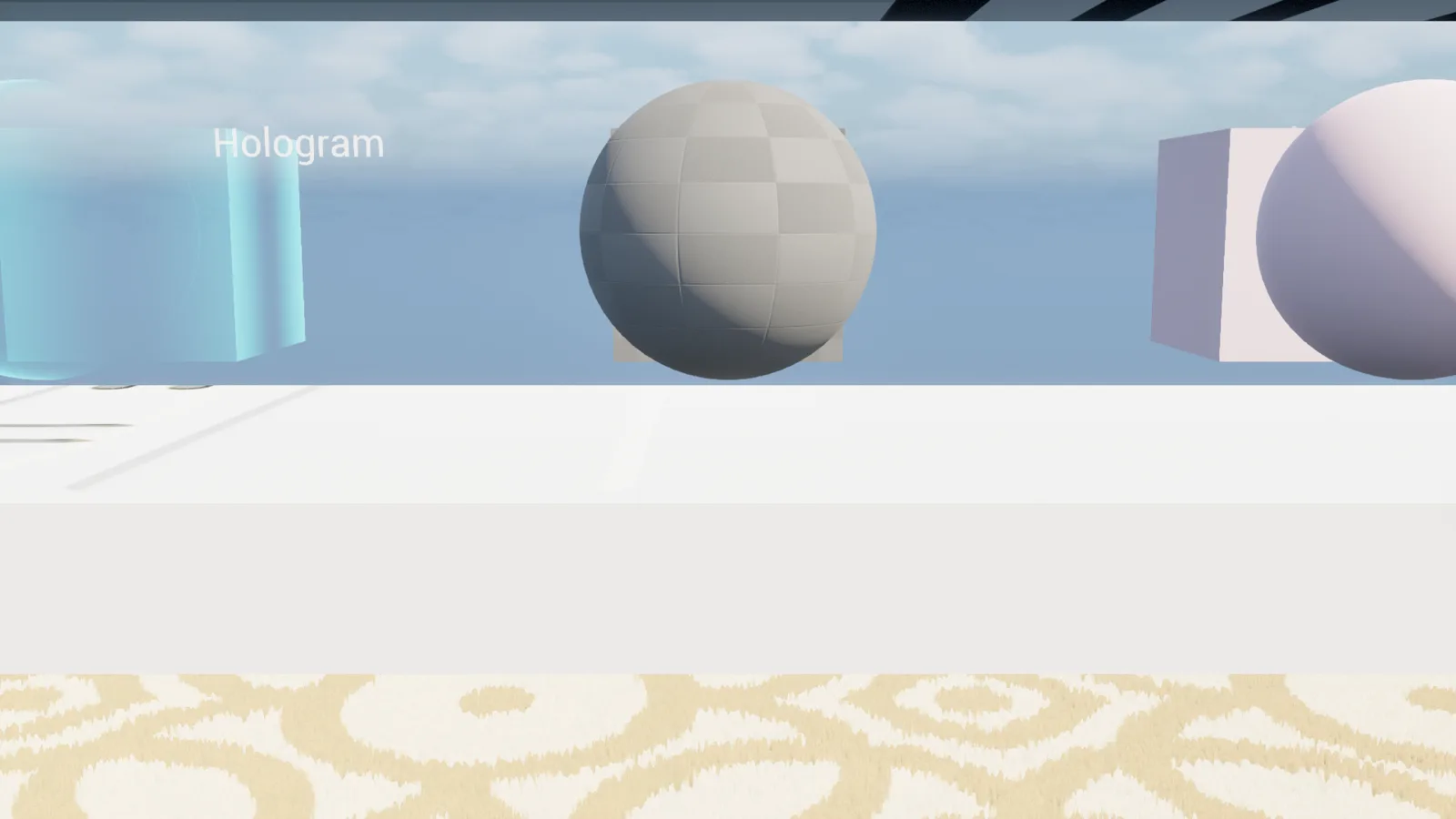 A row of spheres and cubes on a white table against a blue sky background, with a translucent teal glass cube labeled 'Hologram' on the left and a plain gray sphere in the middle.